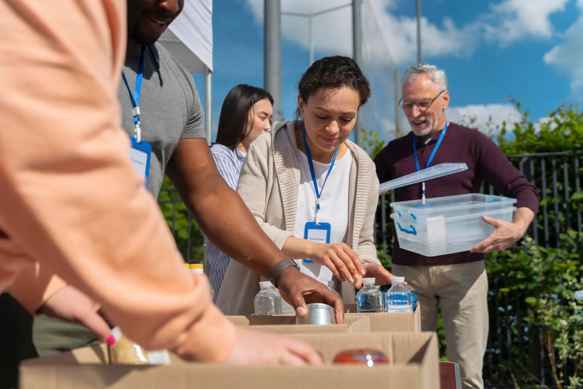 different people doing volunteer work with food